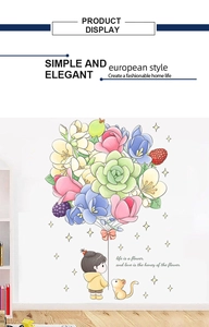 Détail du sticker mural avec ballon floral, fille et citation sur le miel des fleurs
