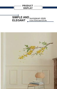 Detailed wall sticker view featuring yellow floral branches in a minimalist home setting