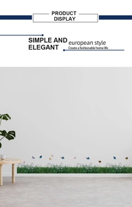 Detailed wall sticker showing vibrant grass and colorful butterflies on a white wall decor