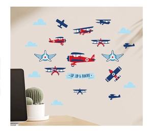 Detail of vintage airplane wall stickers with clouds and Up and Away banner on a beige wall