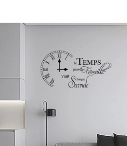 Detail showing French wall decal quote with clock face in a modern home interior