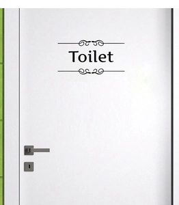 Détail d'un autocollant de porte de toilettes en PVC noir avec motifs décoratifs