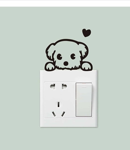 Detail showing cartoon dog wall sticker and heart icon around a power switch panel