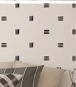 Détail de stickers muraux minimalistes en PVC avec motifs de lignes noires dans une chambre