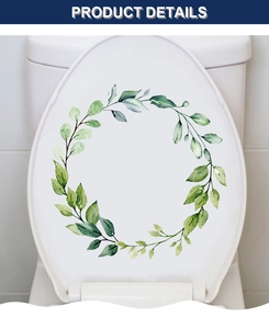 Detailed view of a green leaf wreath watercolor sticker applied to a white toilet lid