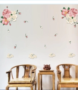Detail view of pink and ivory peony wall decals in a Chinese style living room background