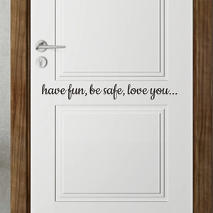 Black 'have fun, be safe, love you' quote wall sticker on minimalist white door