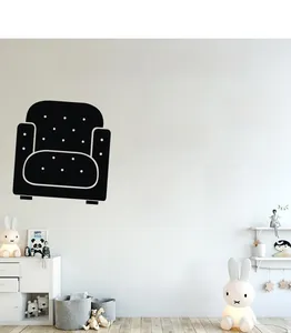Detail view of black game controller wall decals and Games text in a modern room