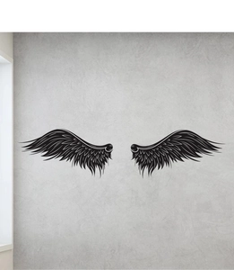 Detailed view of black sketch wing wall decals with fine feather lines on a gray wall