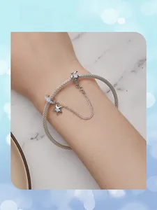 Close-up of S925 silver mesh bracelet featuring sea turtle and star opal charms