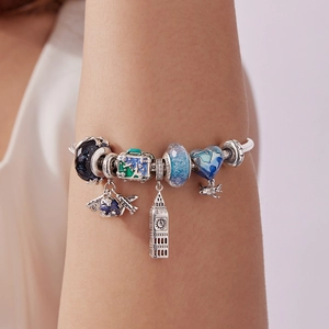 S925 Sterling Silber Reise-Armband mit blauem Koffer und Flugzeug Anhängern