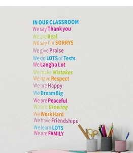 Detail of colorful classroom rule wall decals featuring motivational quotes and art supplies