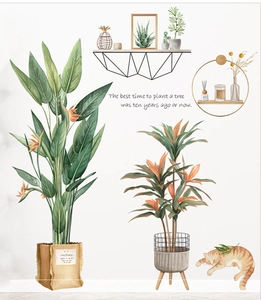 Detail of tropical plant wall stickers with watercolor leaves and a cute sleeping orange cat
