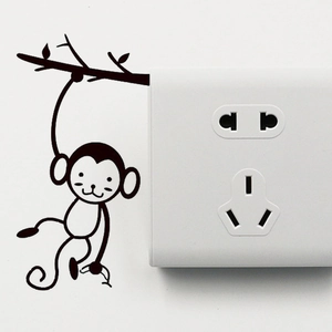 Sticker mural singe sur branche pour décoration d'interrupteur et design d'intérieur