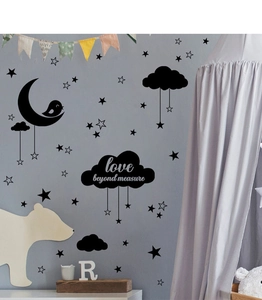 Detail of moon cloud and stars wall stickers with Love Beyond Measure text for kids room