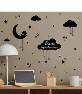Detail of moon and stars wall sticker with love beyond measure text for bedroom