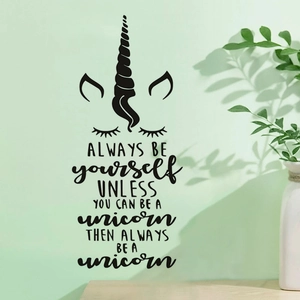 Unicorn wall decal with quote for kids bedroom decor on a light green wall background