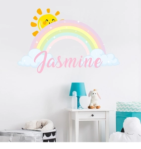 Detail of cartoon rainbow and cloud wall decals with custom pink Jasmine text
