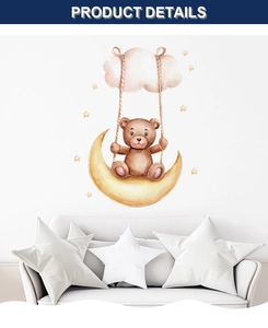 Detail of watercolor teddy bear on moon wall sticker in a cozy nursery room setting