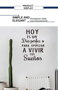 Detailed close-up of a minimalist Spanish wall sticker on a white bedroom wall