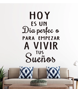 Detail of Spanish inspirational wall decal on living room wall above a modern sofa
