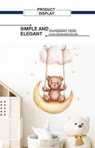 Detail showing watercolor style teddy bear sitting on a yellow moon wall sticker decoration