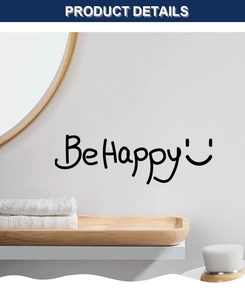 Detail of Be Happy black wall sticker with smiley face on a white bathroom wall