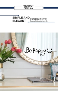 Detail of Be Happy mirrored wall art with elegant golden frame for home decor