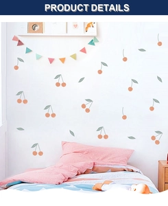Detail of red cherry wall stickers with green leaves on a white wall in child bedroom