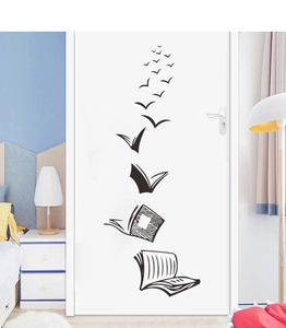 Detail of bird and book wall sticker transformation applied on a white bedroom door
