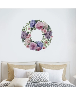 Detail of hand-painted peony and hydrangea floral wreath wall sticker in a bedroom setting