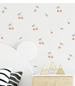 Detail of cute cherry wall stickers in soft pink and green for modern nursery decor