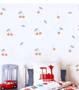 Detail view of cute cherry wall decals in a kids bedroom with modern nursery decor