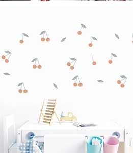 Detailed view of cute hand-drawn cherry wall stickers in a bright children nursery room