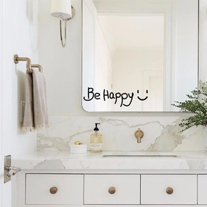 Minimalist Be Happy vinyl wall sticker with smiley face on bathroom mirror surface