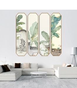 Detail of four-piece ink banana leaf wall art in octagonal frames over a modern sofa