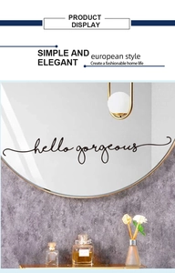 Close-up of Hello Gorgeous lettering on a round metal framed mirror for wall decor