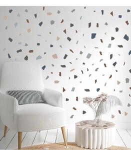 Detail of Nordic terrazzo wall stickers in Morandi colors on a clean white living room wall