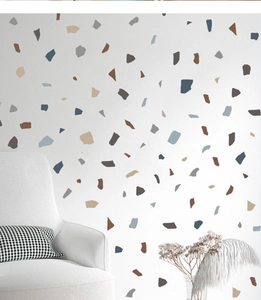 Minimalist grey marble terrazzo wall stickers on white wall with modern armchair decor