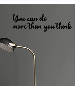 Detail showing 'You can do more than you think' vinyl wall decal on dark grey wall