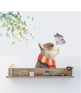 Detail of wall sticker showing a cat with scarf and purple butterfly near green vines
