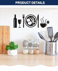 Macro detail of black cutlery and wine bottle wall decals in a modern kitchen setting
