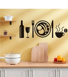 Detailed view of kitchen wall stickers with cutlery and coffee cup silhouettes in a home