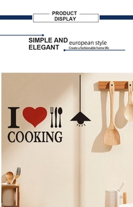 Detail of black PVC kitchen wall sticker with I Love Cooking text and cutlery patterns