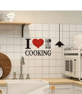 Detail of DIY kitchen wall sticker with red heart icons and black cooking utensils