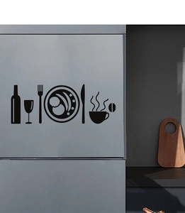 Detail of minimalist black cutlery wall decals applied on a modern grey kitchen appliance
