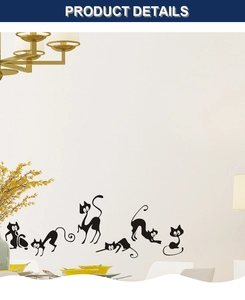 Detail showing various black cat silhouette wall decals in a modern living room setting