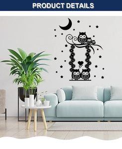 Detail of cute owl family wall sticker with moon and stars in a modern living room