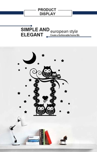 Detailed view of black cartoon owl family wall decal with moon and stars for home decor