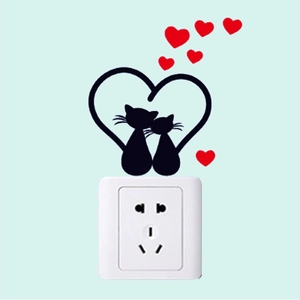 Cartoon black cats wall decal forming a heart shape for light switch decoration